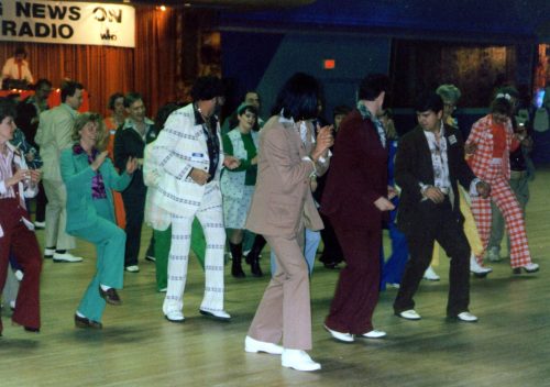 People dancing in leisure suits