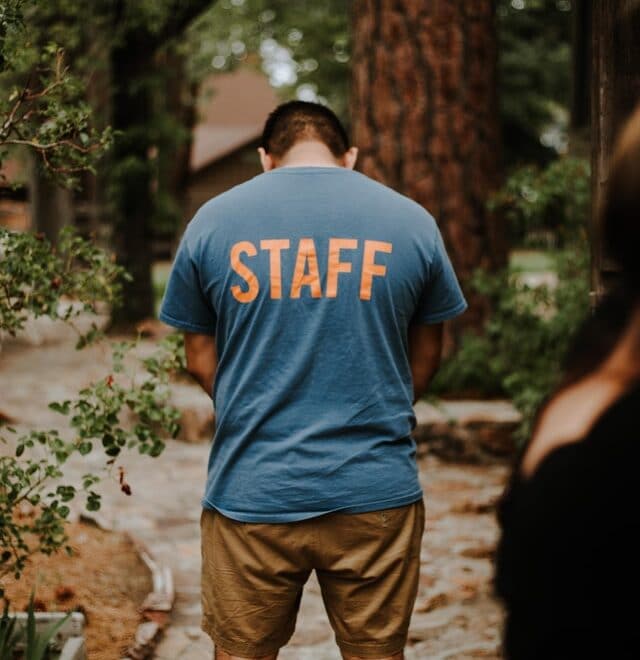 man in a shirt that says staff